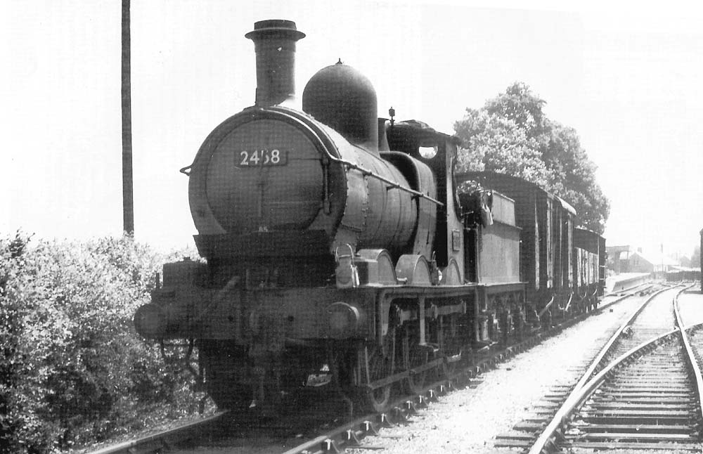 Ex-GWR 0-6-0 'Dean Goods' No 2458 is seen in July 1953 at the head of the short return branch freight to Moreton-in-Marsh