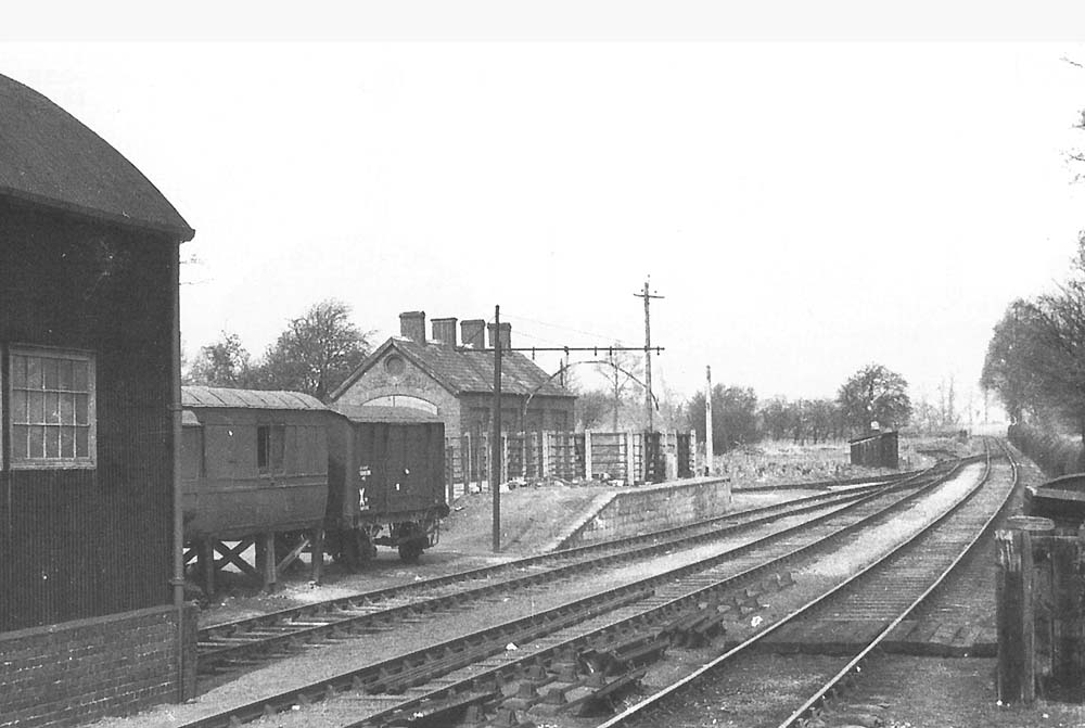 Looking across to the cattle pens from the end of the platform with the goods shed on the left and the original engine shed in the background