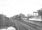 GWR 4-4-0 Bulldog class No 3391 'Dominion of Canada' is seen passing Shirley goods shed and yard on a West of England express service in 1909