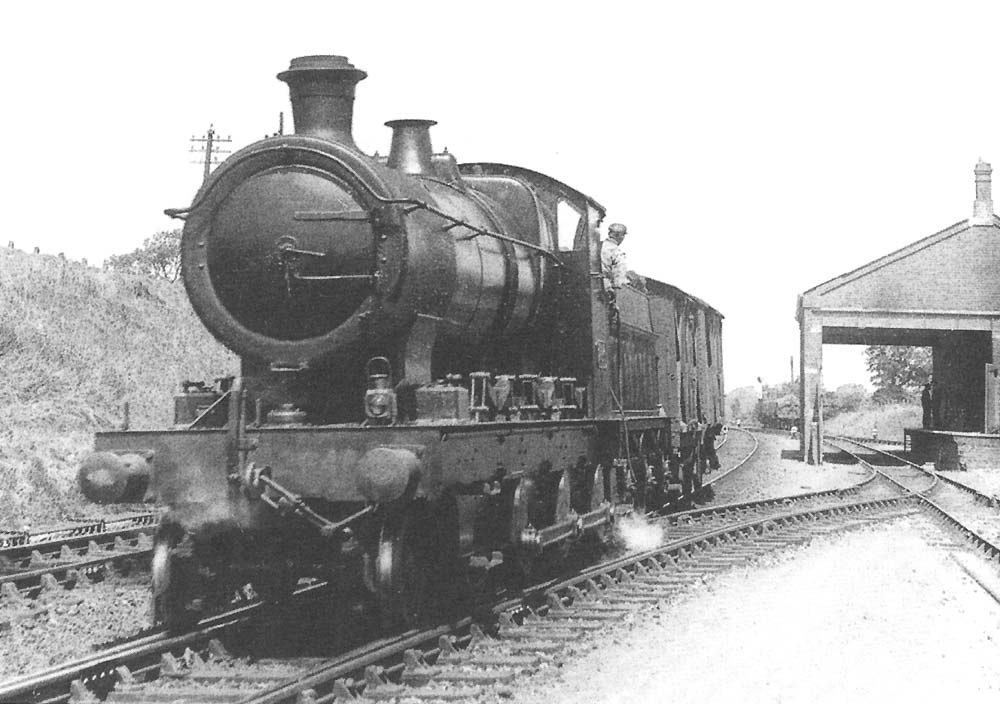 Great Western Railway 2-6-0 26xx (Aberdare) class No 2646 shunting on the down main line with two covered wagons circa 1930