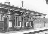 Close up of the up platform showing the two waiting rooms and the gentlemen's toilet and poster boards