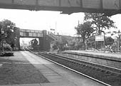 GWR 4-4-0 County class No 3816 'County of Leicester' is seen on an up express to Birmingham as it passes under Haslucks Green bridge