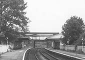 Close up of the passenger buildings on both platforms and the passenger footbridge connecting both platforms