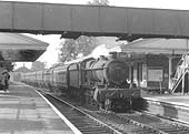 Ex-GWR 4-6-0 Grange class No 6861 'Crynant Grange' is seen at the head of a down West Country express service as it passes through the station