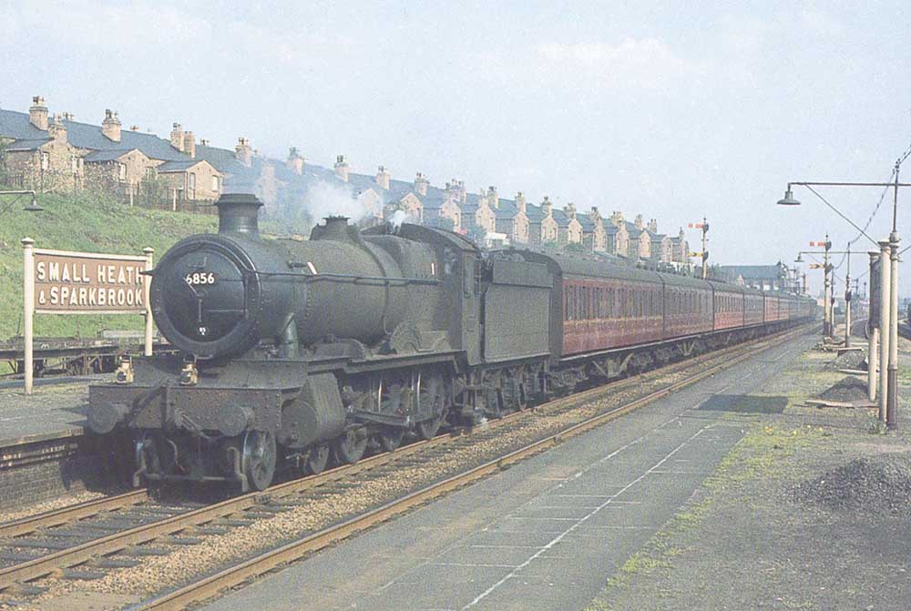Ex-GWR 4-6-0 No 6856 'Stowe Grange' is seen passing through the up main platform at the head of an empty stock working from Tyseley