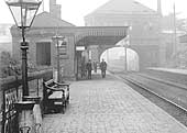 Close up of the down platform, the booking office erected on the overbridge and on the left the down platform's brick built passenger facilities