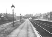 View of Small Heath and Sparkbrook station after quadrupling along the up relief platform whilst a train from Moor Street is arriving in the distance