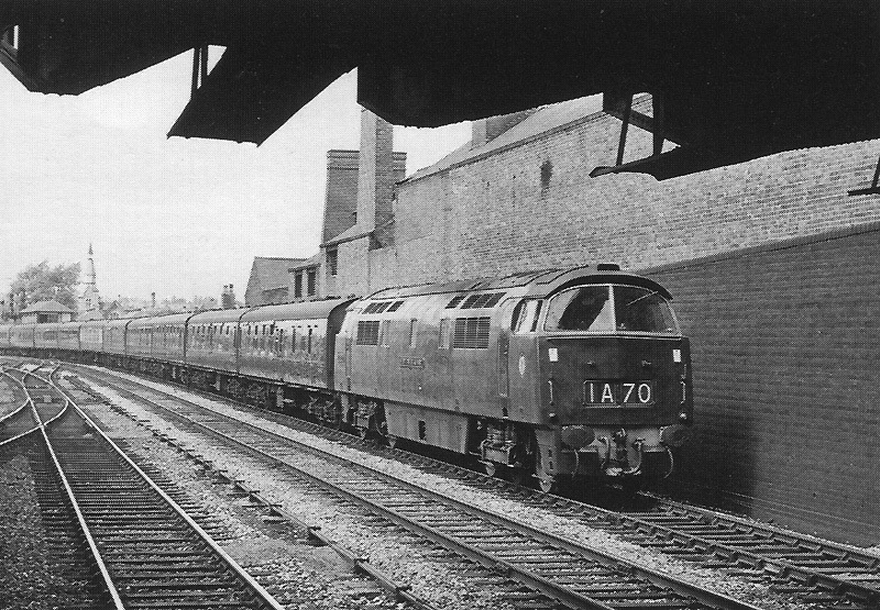 Western Class D1006 'Western Stalwart' is seen approaching Soho and Winson Green station on an up express on 18th August 1962