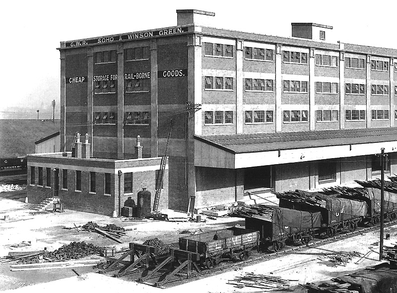Close up showing the west end of the three storey warehouse with the hoist gear housings on the roof