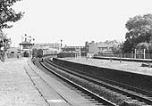 Looking towards Birmingham along the Up Main platform as a parcels train passes Soho and Winson Green Signal Box