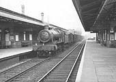GWR 4-6-0 No 5950 Wardley Hall is seen at the head of a down perishables express goods service passing through Solihull station