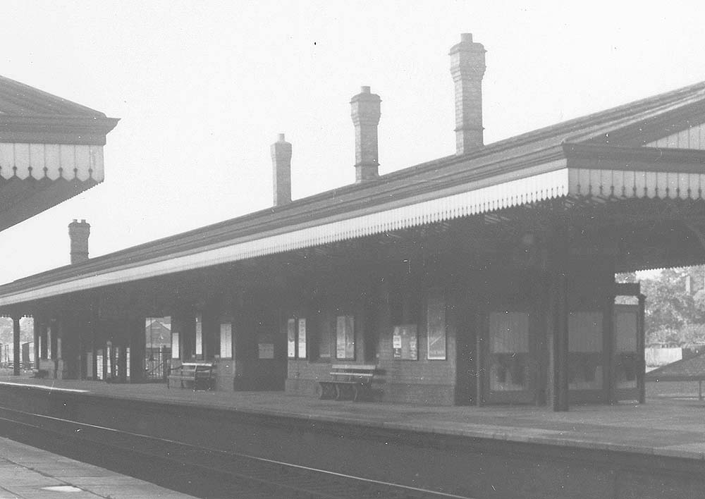 Close up view showing Solihull Station's Down Main platform on the left and the Up Main platform and buildings on the right with the goods yard and shed in the distance