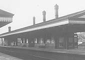 Close up view showing Solihull Station's Down Main platform on the left and the Up Main platform and buildings on the right with the goods yard and shed in the distance