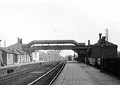 Close up showing the down platform and buildings with an unknown GWR locomotive standing in the down refuge siding