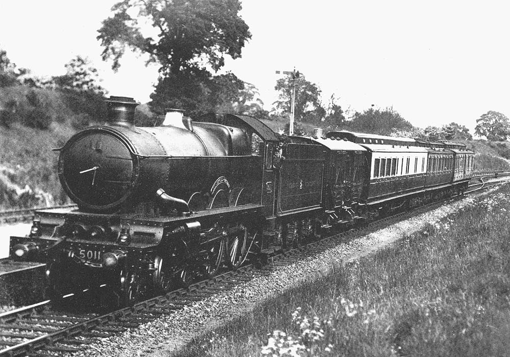 GWR 4-6-0 40xx 'Castle' class No 5011 'Tintagel Castle' in immaculate condition is seen heading north from Southam Road station