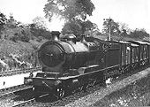GWR 2-8-0 30xx 'ROD' class No 3001 steams past Southam Road station with a Class H through freight train