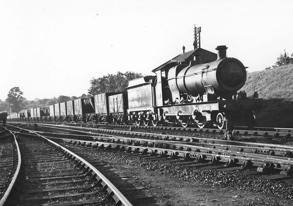 GWR outside framed 2-6-0 Aberdare class No 2608 is seen at the head of a long mineral goods train heading for Banbury