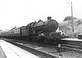 GWR 4-6-0 No 6007 King William III is seen entering the station on an up express to Paddington