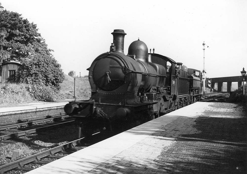 GWR 4-4-0 Duke class No 3276 'St Agnes' and an unidentified 0-6-0PT ghost through the station as they return to Leamington