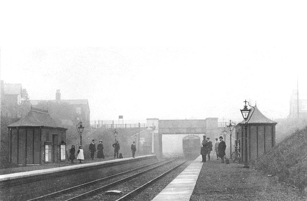 View of Spring Road station looking in the direction of Tyseley as a railmotor arrives on a Moor Street to Stratford upon Avon service
