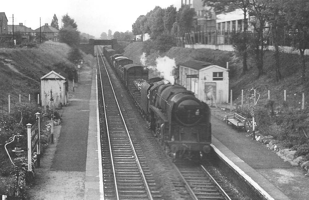 BR Standard 9F 2-10-0 No 92164 approaches Tyseley with an up Type 5 express freight service in 1964