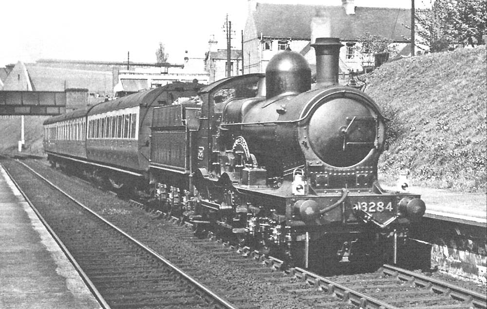 GWR Duke Class 4-4-0 No 3284 'Isle of Jersey' is seen on a three-coach express service on 9th May 1939