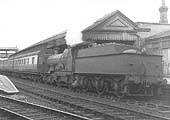 GWR 4-4-0 Bulldog class No 3446 'Goldfinch' is seen standing at the down platform whilst running tender first on a local passenger service
