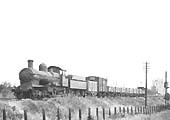 GWR 4-4-0 Earl class No 3210, formerly 'Earl Cairns' is seen leaving Stratford on Avon at the head of a short up goods on 26th June 1943
