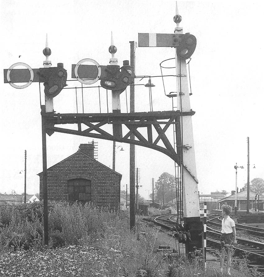 View of the signal gantry controlling the access to Stratford on Avon station, the engine shed and the livestock market's goods siding