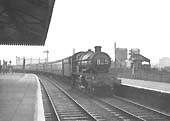 An unidentified ex-GWR 4-6-0 Castle class locomotive is seen arriving at Stratford on Avon at the head of the 9:15am Wolverhampton to Penzance