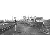 GWR Diesel Railcars W37 W and W38 W are seen with a Third class coach in between departing on the up 5:05pm Cardiff to Birmingham service