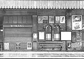 View from Platform 2 of Wymans bookstall with the platform ticket barrier seen to its left and the parcel office doorway seen to the right