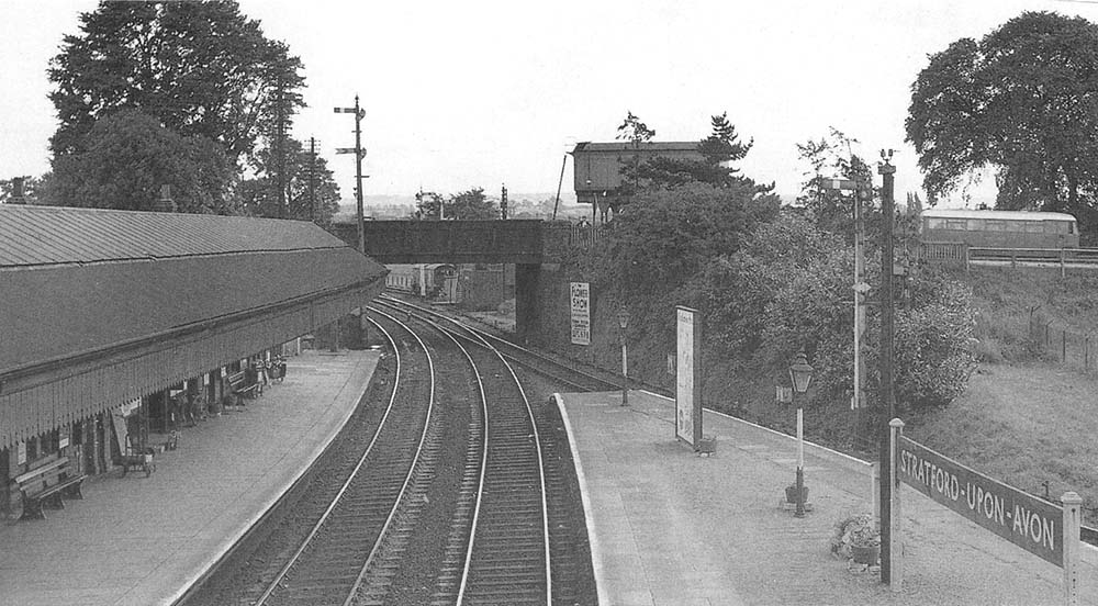 Looking south towards Honeybourne from the passenger footbridge showing the water tank and refuge siding on the other side of Alcester Road bridge