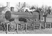 Ex-GWR 4-4-0 Bulldog class No 3447 'Jackdaw' is seen in the up refuge siding at the head of empty stock ready to take forward a local passenger service