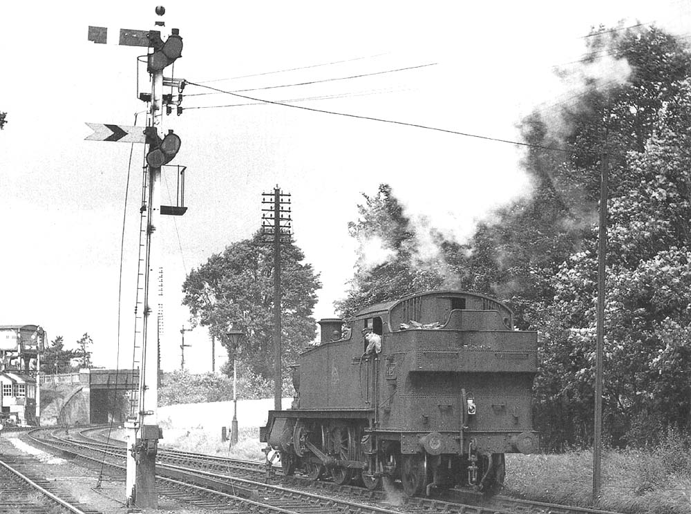 Ex-GWR 2-6-2T 'Large Prairie' No 4127 stands at the crossover south of Stratford on Avon West Signal Box ready to run back into the station