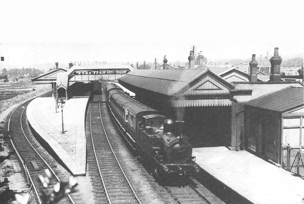 GWR 2-4-0T 35xx class 'Metro Tank' No 3563 is seen at the head of a five-coach Leamington Spa to Stratford on Avon local passenger service