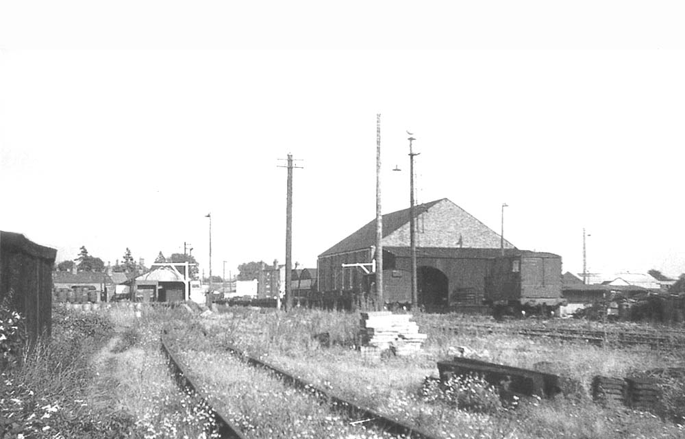 Looking towards Birmingham Road with the original 1863 station turned goods shed on the right and Flowers Brewery beer shed on the left