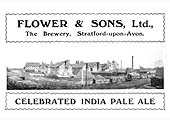 A Flower & Sons Ltd beer bottle label depicting the brewery in a very well kept state with railway wagons standing in the goods yard