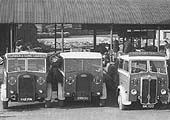 Flower & Son Ltd's lorries standing in line with empty cases ready to take their turn in collecting bottled beer for local distribution