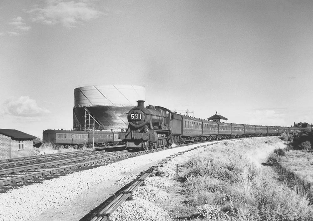 British Railways built Modified Hall class No 6986 'Rydal Hall' is seen passing Stratford on Avon East Signal Box on 16th August 1958