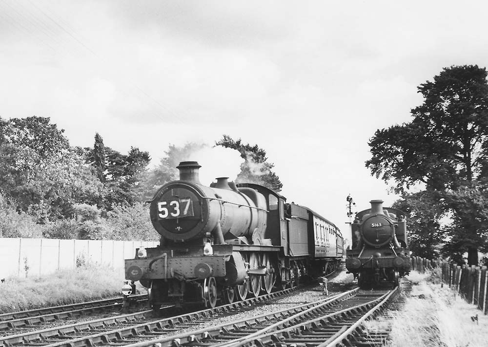 Ex-GWR 4-6-0 Hall class No 4980 'Wrottesley Hall' passes ex-GWR 2-6-2T 'Large Prairie' No 5163 whilst working the 10:35am from Paignton