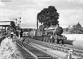 Ex-GWR 4-6-0 Hall class No 4973 'Sweeney Hall' passes Stratford on Avon West Signal Box on a Birmingham to Cardiff and Swansea service