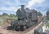 Ex-GWR 2-8-0 28xx class No 2883 is seen passing through the station on a down working to the Severn Tunnel Junction on 16th August 1958