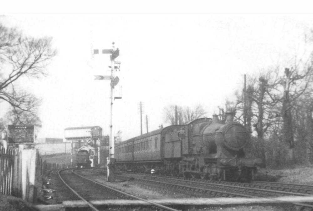An unidentified GWR 4-4-0 33xx Class locomotive, possibly 3379 or 3382, on a local passenger service to Worcester shortly after the Second World War