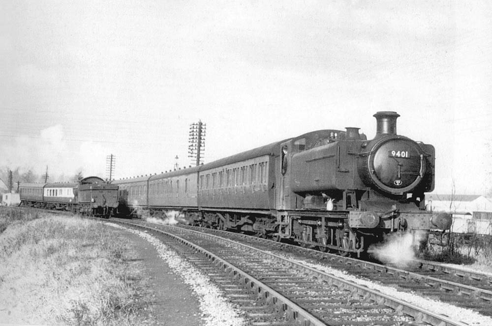 Ex-GWR 0-6-0PT No 9401 is seen heading towards Stratford-on-Avon Race Course Platform on 14th December 1957