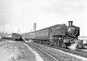 Ex-GWR 0-6-0PT No 9401 is seen heading towards Stratford-on-Avon Race Course Platform on 14th December 1957