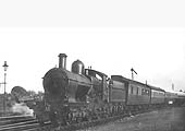 GWR 4-4-0 Duke Class No 3269 'Dartmoor' is seen leaving Stratford on Avon on a northbound train circa 1935
