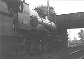GWR 4-4-0 County class No 3834 'County of Somerset' stands in the station with a southbound train on 6th July 1933
