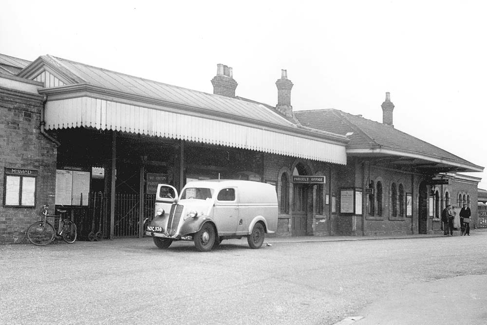 An external view of Stratford on Avon station in the early days of its ownership by British Railways with a Morris Van parked outside