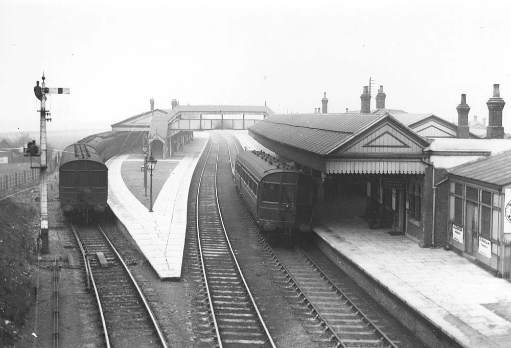 View of Stratford on Avon station with a local passenger service standing at Platform Three and a single-coach Auto-train at Platform One